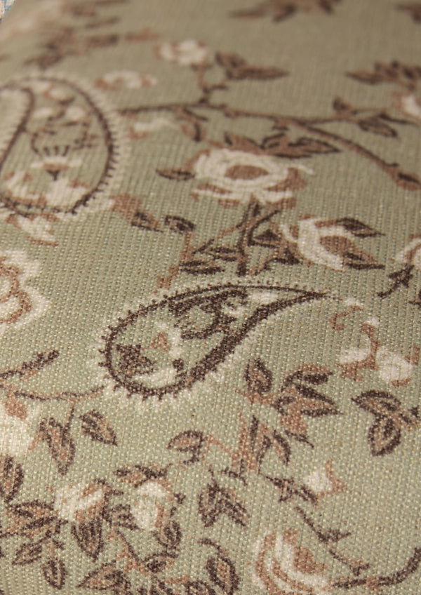 Ivory, tan and brown paisley fabric on a muted green base. 