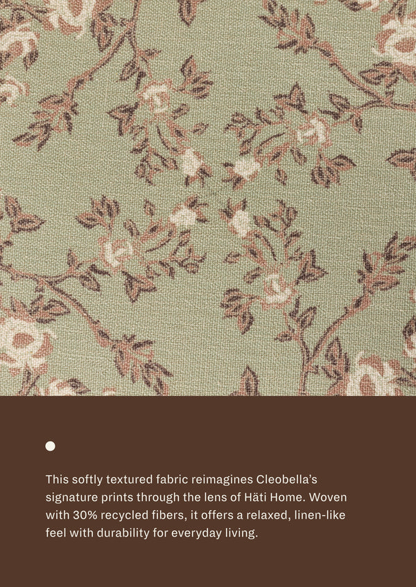 Close-up of the Aloe Botanical fabric, featuring delicate botanical motifs in soft sage, taupe, blush, and cream tones. Woven with recycled fibers, the textile offers a relaxed, linen-like texture designed for everyday durability and comfort.
