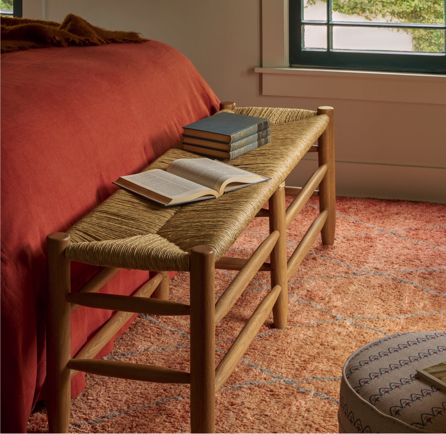 The Mina Bench in a bedroom setting.