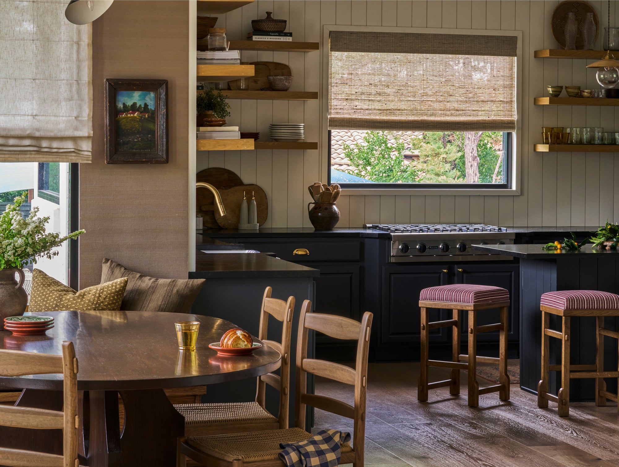 Cozy kitchen with Tiga dining chairs and Sari counter stools and window view