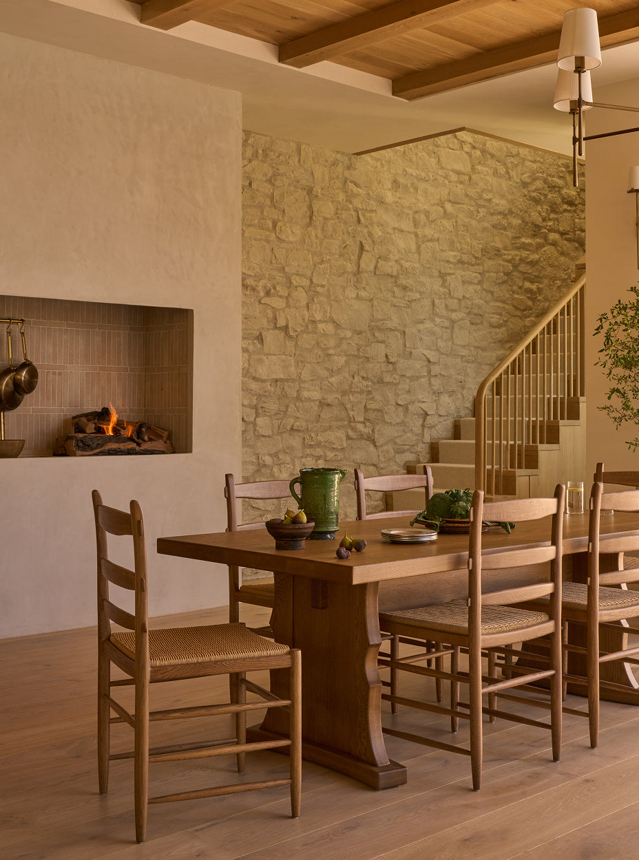 Dining area with hollis dining table and tiga dining chairs in a rustic kitchen.