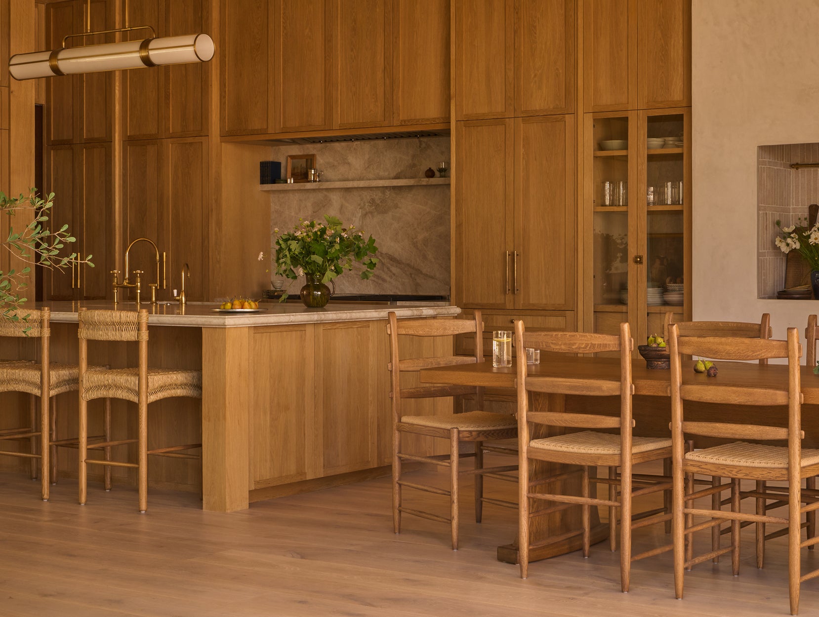 Wood kitchen with Suma counter stools and Tiga dining chairs